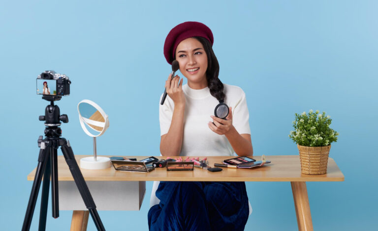 beauty-blog-happy-asian-makeup-artist-recording-cosmetics-product-review-showing-her-makeup