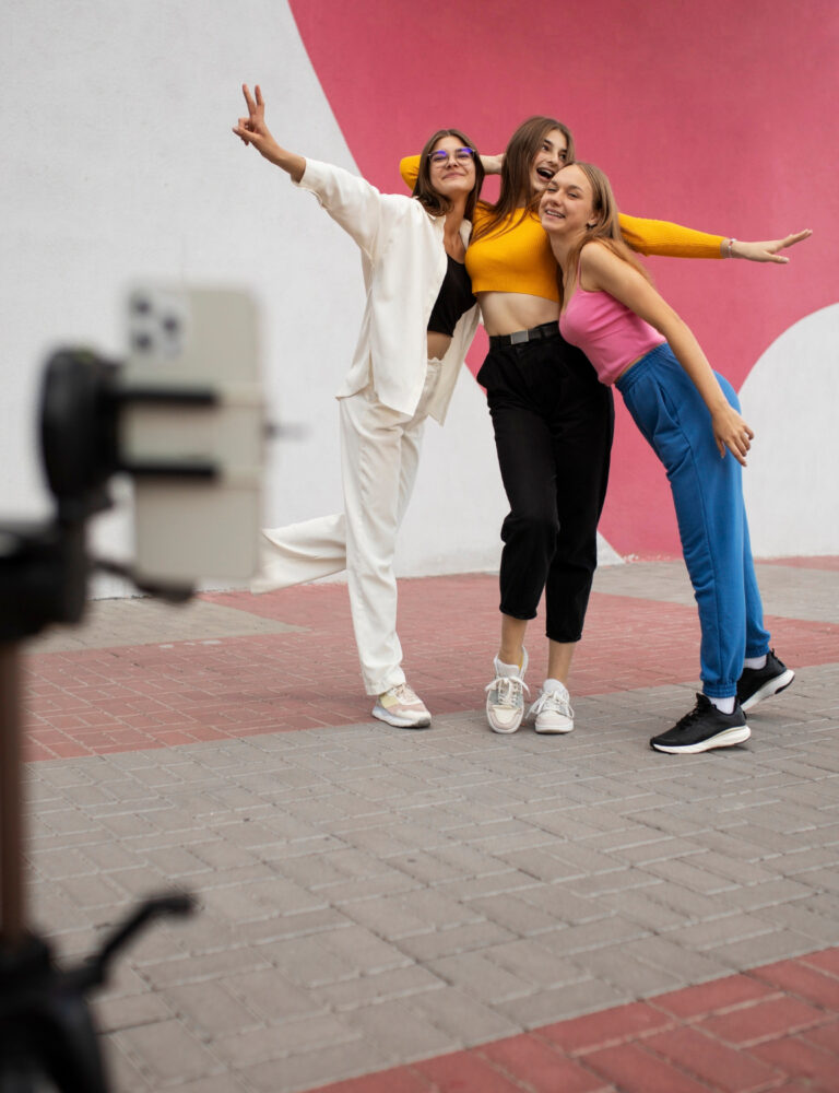 young-teenage-girls-recording-reels-themselves-outdoors-social-media